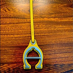 Etienne Aigner yellow bag charm